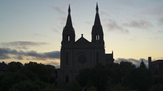 DX0002_176_031 - 5.7K aerial stock footage of the Cathedral of Saint Joseph at twilight in Sioux Falls, South Dakota