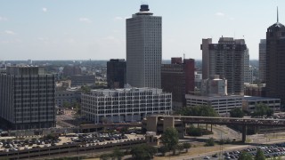 DX0002_177_040 - 5.7K aerial stock footage reverse view and orbit of city hall and office tower in Downtown Memphis, Tennessee