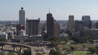 DX0002_177_041 - 5.7K aerial stock footage of a tall office tower with spire in Downtown Memphis, Tennessee