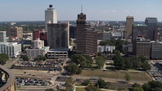 DX0002_178_016 - 5.7K aerial stock footage ascend and orbit Raymond James Tower in Downtown Memphis, Tennessee