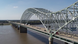 DX0002_178_019 - 5.7K aerial stock footage flyby light traffic and a sign on the bridge, Memphis, Tennessee