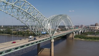 5.7K aerial stock footage flying by cars crossing the bridge to Memphis, Tennessee Aerial Stock Footage | DX0002_178_021