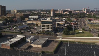 5.7K aerial stock footage orbit and fly away from an office building, Downtown Memphis, Tennessee Aerial Stock Footage | DX0002_180_009