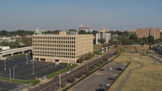 5.7K aerial stock footage orbit and fly toward an office building, Downtown Memphis, Tennessee Aerial Stock Footage | DX0002_180_010