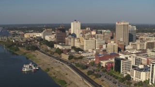 5.7K aerial stock footage of flying by office buildings near Wolf River Harbor in Downtown Memphis, Tennessee Aerial Stock Footage | DX0002_180_014