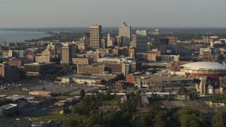 5.7K aerial stock footage flying by the skyline and near FedEx Forum arena at sunset, Downtown Memphis, Tennessee Aerial Stock Footage | DX0002_180_035