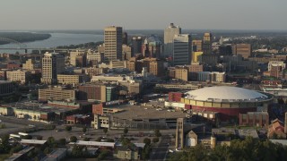 5.7K aerial stock footage flying by the skyline behind FedEx Forum arena at sunset, Downtown Memphis, Tennessee Aerial Stock Footage | DX0002_180_036