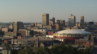 5.7K aerial stock footage of office towers at sunset, seen while descending near the arena, Downtown Memphis, Tennessee Aerial Stock Footage | DX0002_180_043