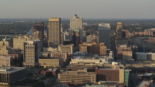 5.7K aerial stock footage of flying past office towers at sunset, Downtown Memphis, Tennessee Aerial Stock Footage | DX0002_181_002