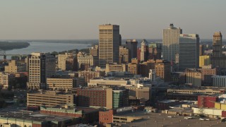 5.7K aerial stock footage approach and flyby One Commerce Square office tower at sunset, Downtown Memphis, Tennessee Aerial Stock Footage | DX0002_181_008