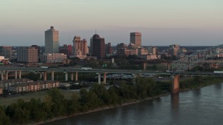 5.7K aerial stock footage focus on the city's skyline as traffic crosses the bridge at sunset, Downtown Memphis, Tennessee Aerial Stock Footage | DX0002_181_020