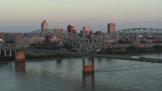 5.7K aerial stock footage of the city's skyline as traffic crosses the bridge at sunset, Downtown Memphis, Tennessee Aerial Stock Footage | DX0002_181_021