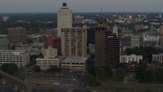 5.7K aerial stock footage passing by apartment high-rise and office tower at sunset in Downtown Memphis, Tennessee Aerial Stock Footage | DX0002_181_032