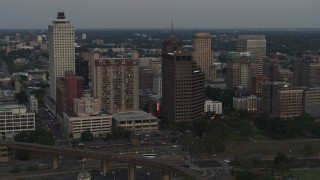 5.7K aerial stock footage of passing office and apartment high-rises at sunset in Downtown Memphis, Tennessee Aerial Stock Footage | DX0002_181_033