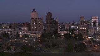 5.7K aerial stock footage of orbiting apartment and office high-rises at twilight in Downtown Memphis, Tennessee Aerial Stock Footage | DX0002_182_004