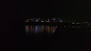 5.7K aerial stock footage video of lights on the Hernando de Soto Bridge at night, Downtown Memphis, Tennessee Aerial Stock Footage | DX0002_182_009