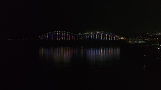 5.7K aerial stock footage video of lights on the Hernando de Soto Bridge at night, Downtown Memphis, Tennessee Aerial Stock Footage | DX0002_182_011