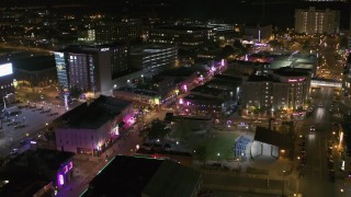 5.7K aerial stock footage reverse view of Beale Street and BB King Boulevard intersection at night in Downtown Memphis, Tennessee Aerial Stock Footage | DX0002_182_044