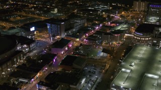 5.7K aerial stock footage of flying away from intersection of Beale Street and BB King Boulevard at night in Downtown Memphis, Tennessee Aerial Stock Footage | DX0002_182_047