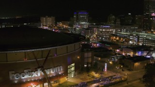 5.7K aerial stock footage stationary view of FedEx Forum and Beale Street clubs at night in Downtown Memphis, Tennessee Aerial Stock Footage | DX0002_182_050