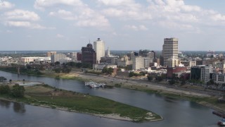 5.7K aerial stock footage of flying by and away from the city's skyline, Downtown Memphis, Tennessee Aerial Stock Footage | DX0002_183_004