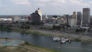 5.7K aerial stock footage of passing by the city's skyline, Downtown Memphis, Tennessee Aerial Stock Footage | DX0002_183_006