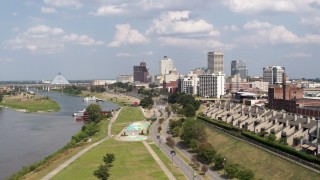 5.7K aerial stock footage the city's skyline and Wolf River Harbor during descent, Downtown Memphis, Tennessee Aerial Stock Footage | DX0002_183_018