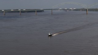 5.7K aerial stock footage of tracking a boat racing across the Mississippi River, Memphis, Tennessee Aerial Stock Footage | DX0002_183_019