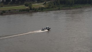 5.7K aerial stock footage of a boat speeding across the Mississippi River, Memphis, Tennessee Aerial Stock Footage | DX0002_183_020