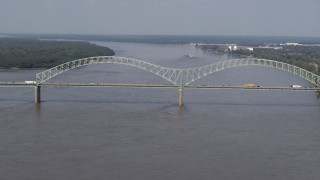 5.7K aerial stock footage reverse view of the Hernando de Soto Bridge as traffic crosses the span, Memphis, Tennessee Aerial Stock Footage | DX0002_183_029