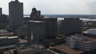 DX0002_184_011 - 5.7K aerial stock footage of slowly circling a county government building beside police station in Downtown Memphis, Tennessee