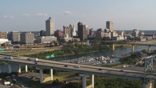 5.7K aerial stock footage focus on skyline while flying by the bridge, Downtown Memphis, Tennessee Aerial Stock Footage | DX0002_185_005