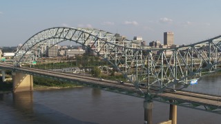 5.7K aerial stock footage ascend as traffic crosses the bridge near Downtown Memphis, Tennessee Aerial Stock Footage | DX0002_185_006