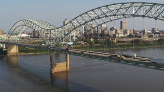 5.7K aerial stock footage flyby bridge traffic near welcome sign with view of skyline, Downtown Memphis, Tennessee Aerial Stock Footage | DX0002_185_010