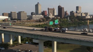 5.7K aerial stock footage of traffic on the bridge near the skyline, Downtown Memphis, Tennessee Aerial Stock Footage | DX0002_185_013