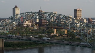 5.7K aerial stock footage of the skyline seen while passing the bridge at sunset, Downtown Memphis, Tennessee Aerial Stock Footage | DX0002_185_025