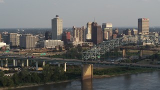 5.7K aerial stock footage of the skyline behind the bridge at sunset, Downtown Memphis, Tennessee Aerial Stock Footage | DX0002_185_029