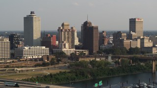 5.7K aerial stock footage of passing the downtown skyline at sunset, Downtown Memphis, Tennessee Aerial Stock Footage | DX0002_185_031