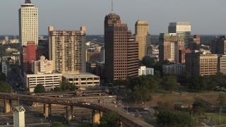 5.7K aerial stock footage of orbiting an apartment complex and office high-rise at sunset, Downtown Memphis, Tennessee Aerial Stock Footage | DX0002_185_036