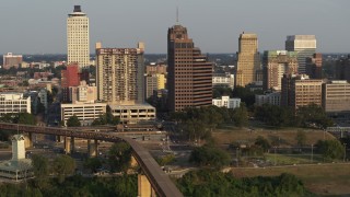 5.7K aerial stock footage of an orbit of an apartment complex and office tower at sunset, Downtown Memphis, Tennessee Aerial Stock Footage | DX0002_185_038