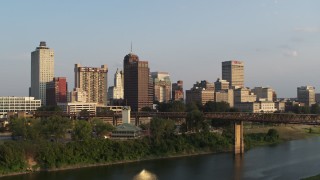 DX0002_186_001 - 5.7K aerial stock footage approach the downtown skyline at sunset, orbit city buildings, Downtown Memphis, Tennessee