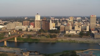 5.7K aerial stock footage of flying away from the downtown skyline at sunset, Downtown Memphis, Tennessee Aerial Stock Footage | DX0002_186_003