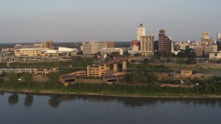 5.7K aerial stock footage orbit museum at sunset, fly away to reveal skyline, Downtown Memphis, Tennessee Aerial Stock Footage | DX0002_186_014