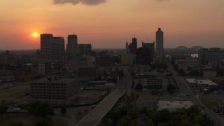 5.7K aerial stock footage fly away from the downtown skyline and the setting sun, then descent, Downtown Memphis, Tennessee Aerial Stock Footage | DX0002_186_031