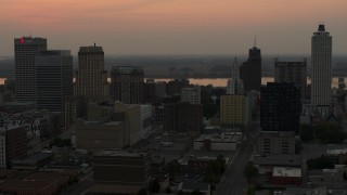 5.7K aerial stock footage an orbit of the office towers of the skyline at sunset, Downtown Memphis, Tennessee Aerial Stock Footage | DX0002_186_036