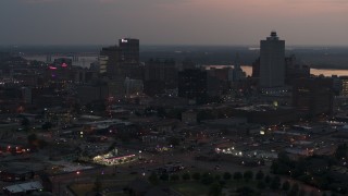 5.7K aerial stock footage of flying away from the city's downtown skyline at twilight, Downtown Memphis, Tennessee Aerial Stock Footage | DX0002_187_004