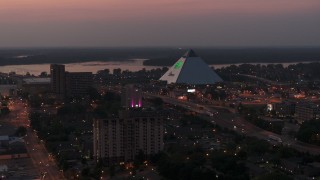 5.7K aerial stock footage a stationary view of the Memphis Pyramid at twilight, Downtown Memphis, Tennessee Aerial Stock Footage | DX0002_187_012