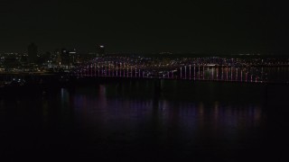 5.7K aerial stock footage static view of the skyline and the bridge with colorful lights at night, Downtown Memphis, Tennessee Aerial Stock Footage | DX0002_187_045