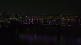 5.7K aerial stock footage slowly fly to the bridge with colorful lights and skyline at night, Downtown Memphis, Tennessee Aerial Stock Footage | DX0002_187_047