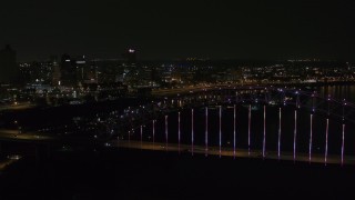 5.7K aerial stock footage fly over the bridge with colorful lights toward skyline at night, Downtown Memphis, Tennessee Aerial Stock Footage | DX0002_187_048